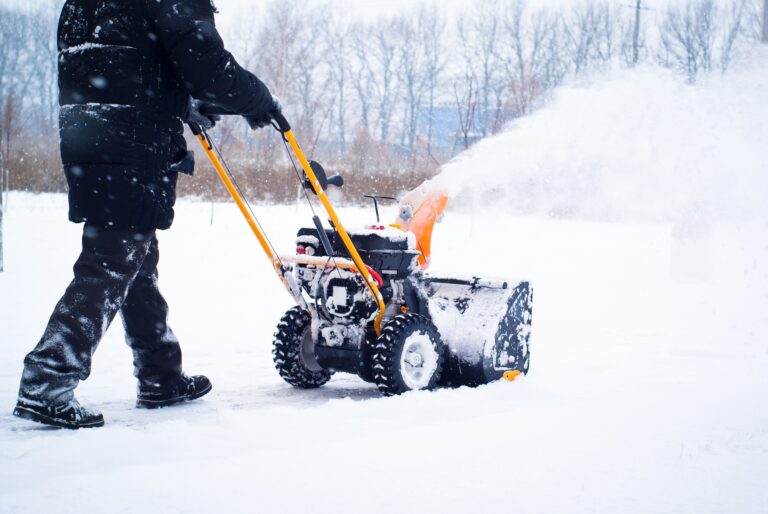 A man cleans snow