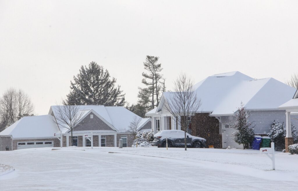 Homes & neighborhoods houses covered with snow after a cold winter snow storm