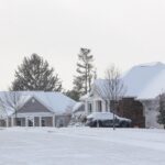 Homes & neighborhoods houses covered with snow after a cold winter snow storm