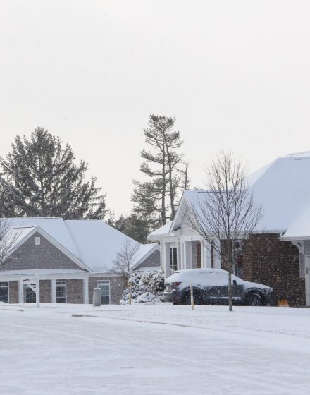 Homes & neighborhoods houses covered with snow after a cold winter snow storm